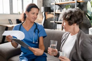 a woman holding a tablet and a glass of water