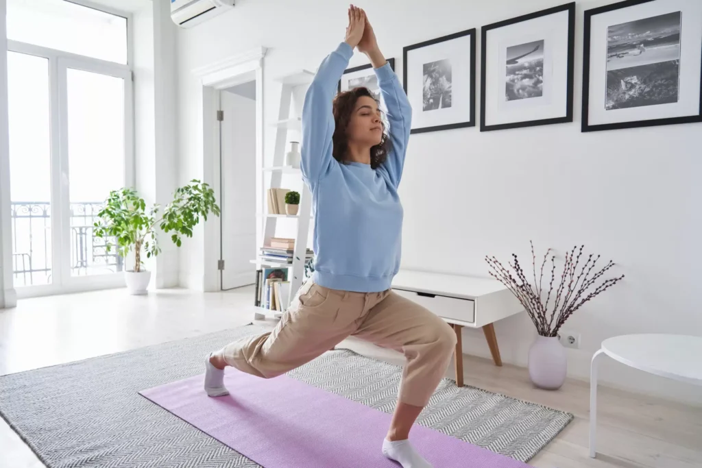 a woman doing yoga in a room
