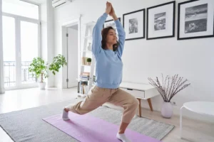 a woman doing yoga in a room