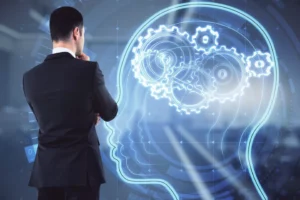 a man looking at a drawing of gears