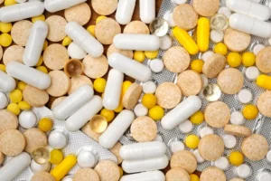 a pile of pills and tablets