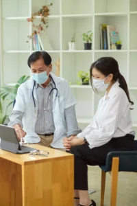 a man and woman wearing masks