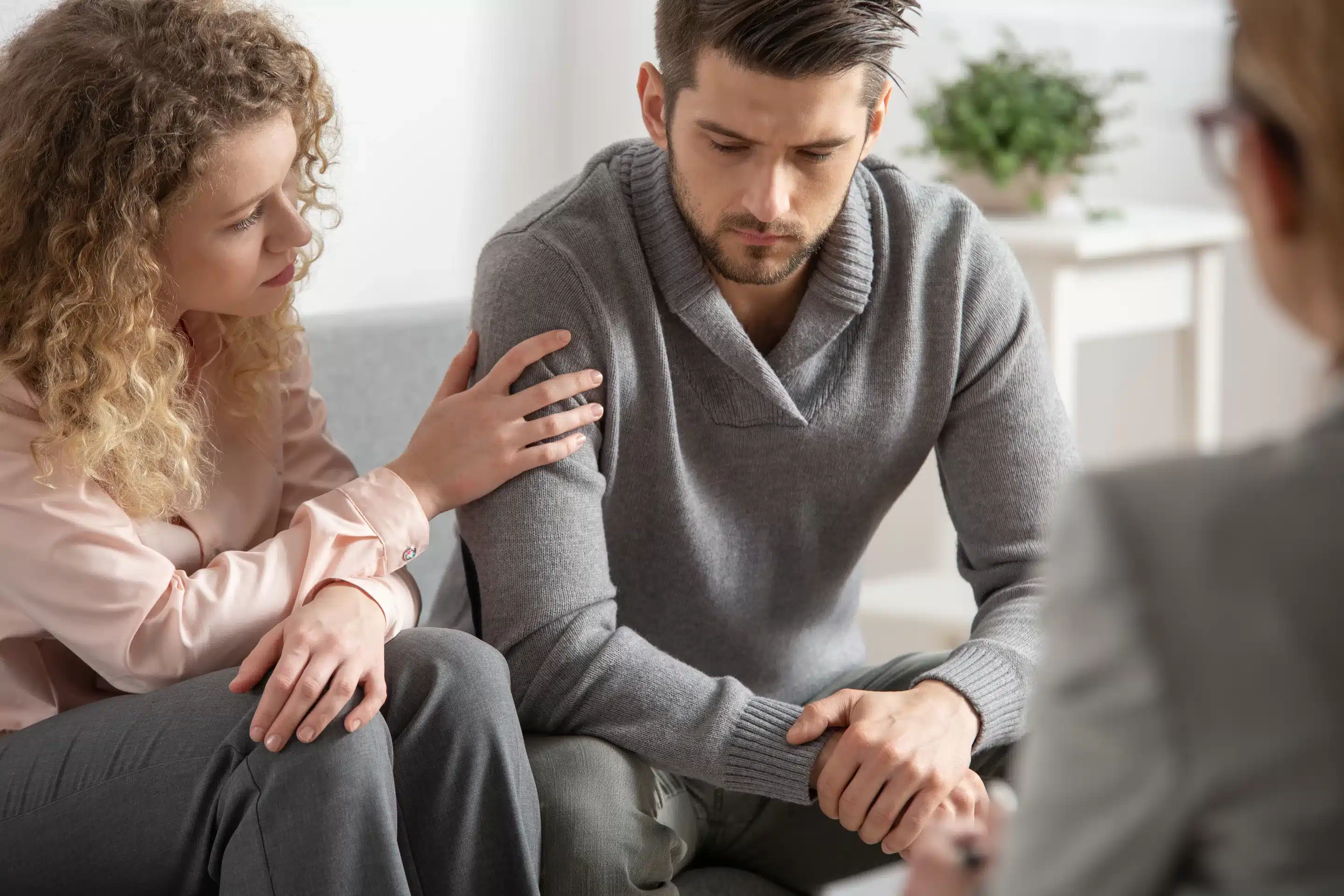 a man and woman sitting on a couch