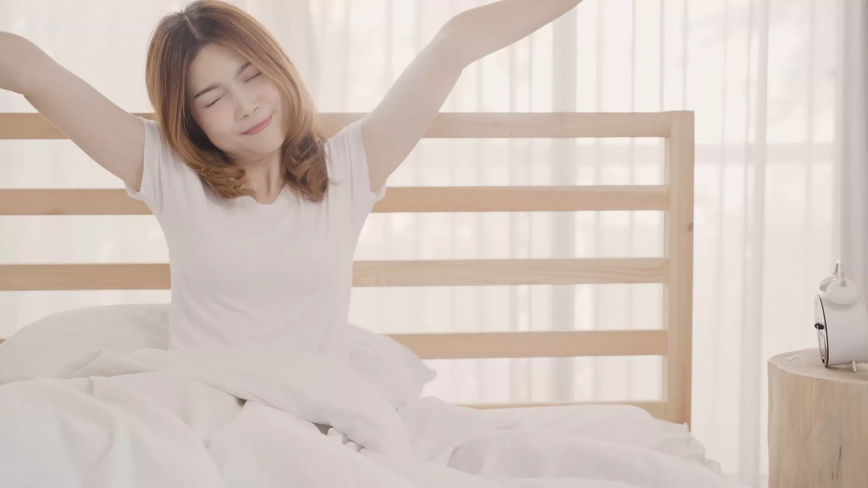 Beautiful attractive young Asian woman wake up