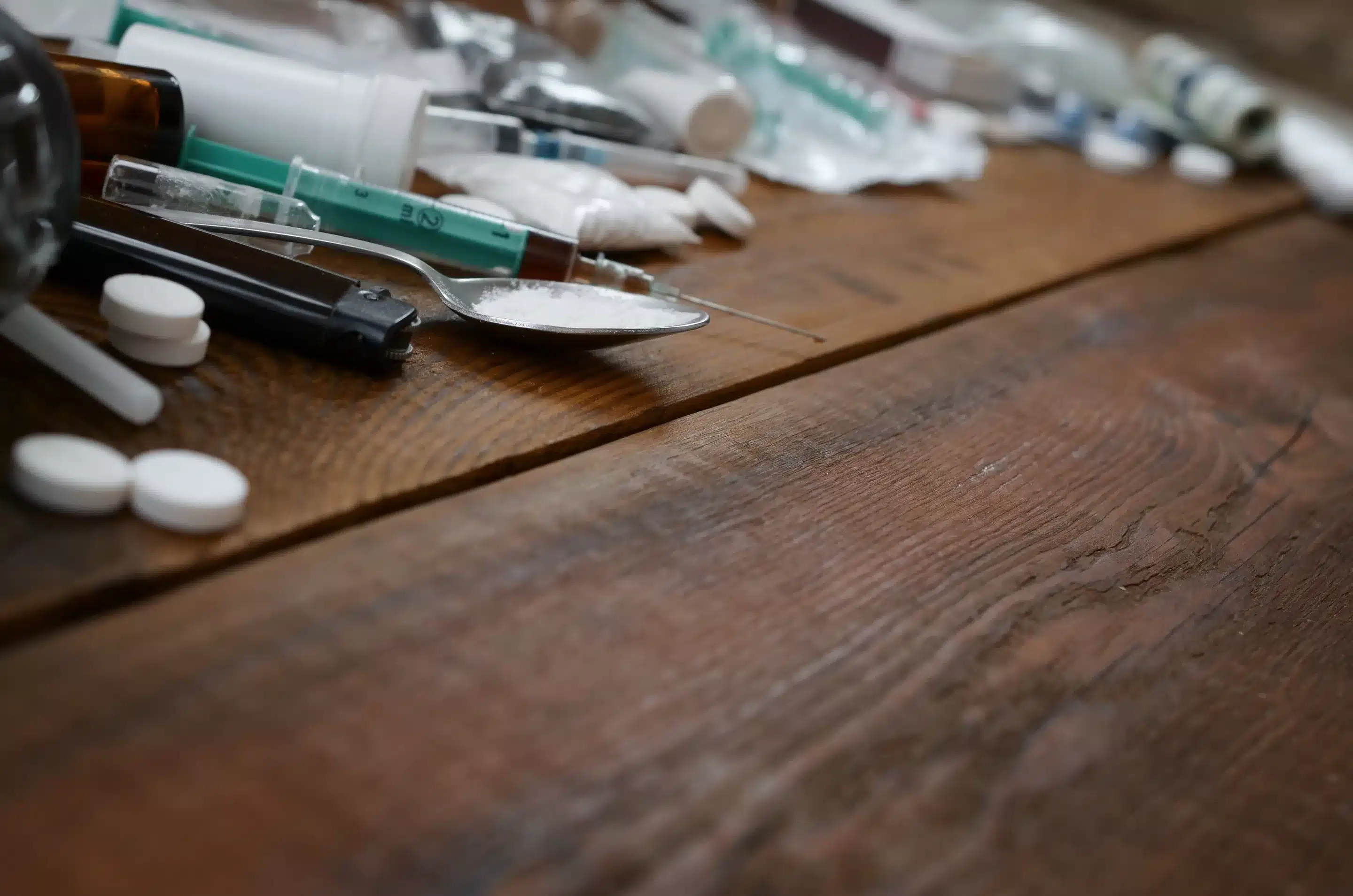 Effects of Percocet (and other opiates) Use a spoon and syringes on a table
