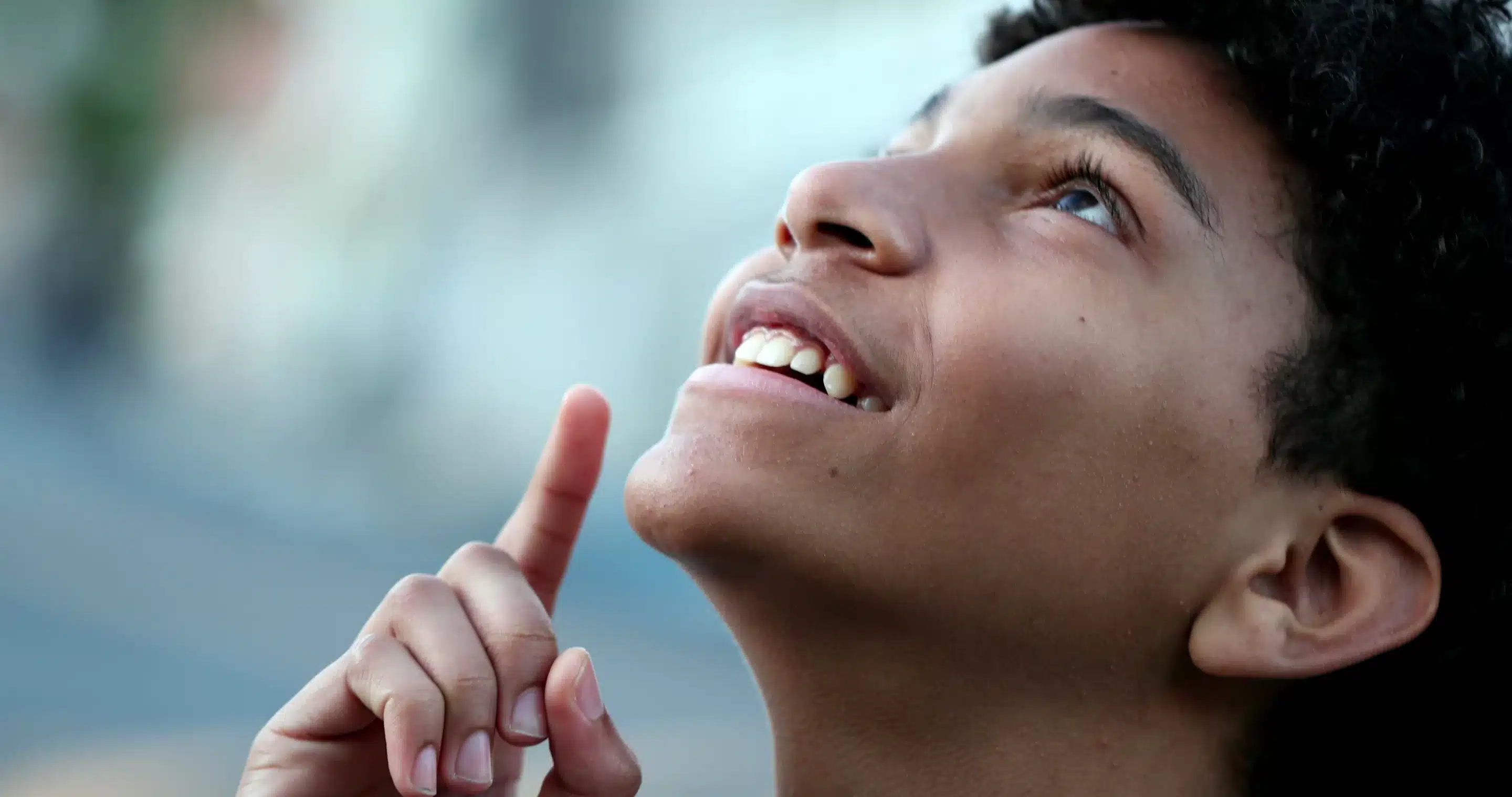 Child closing eyes praying. Spiritual kid prays with eyes closed