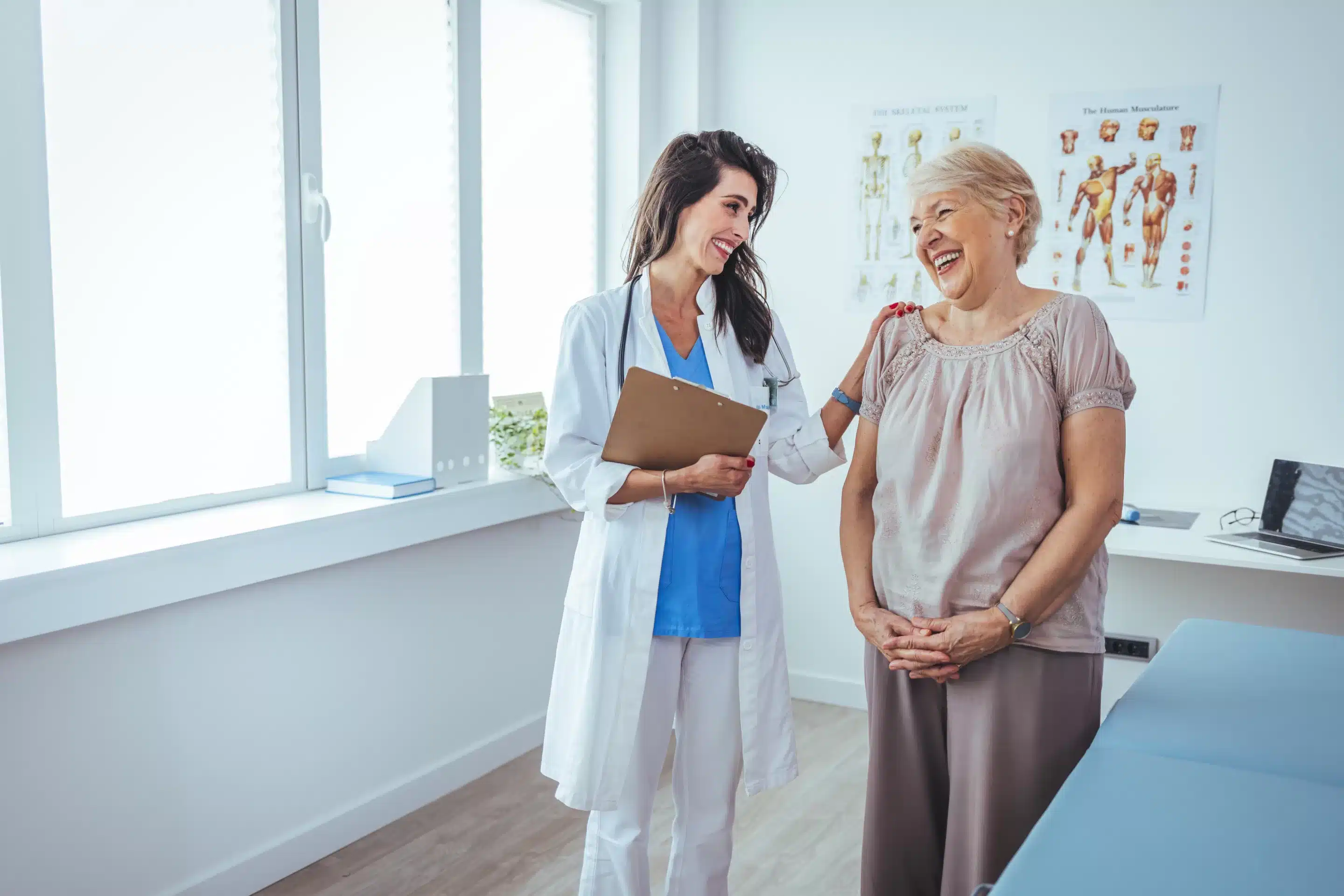 Smiling female patient at consultation with woman doctor.