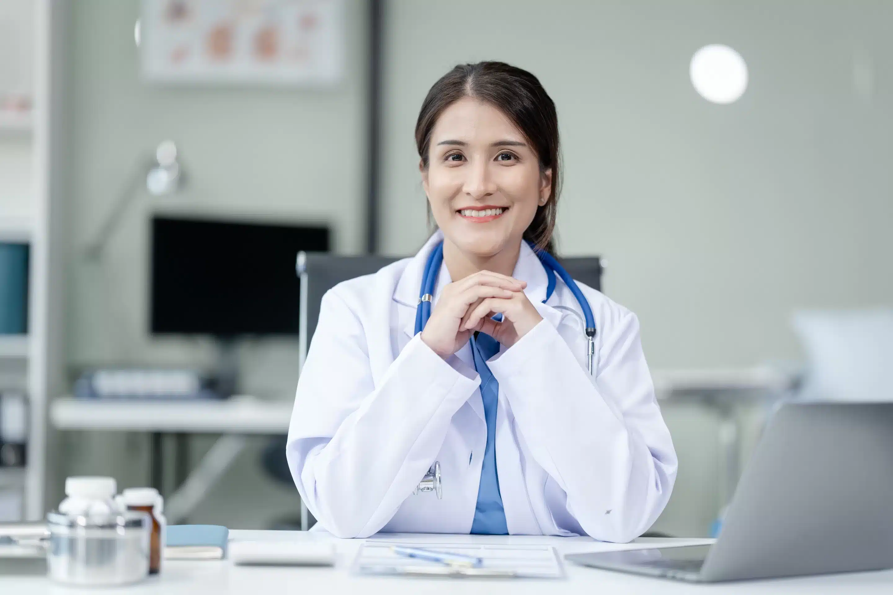 a woman in a white coat