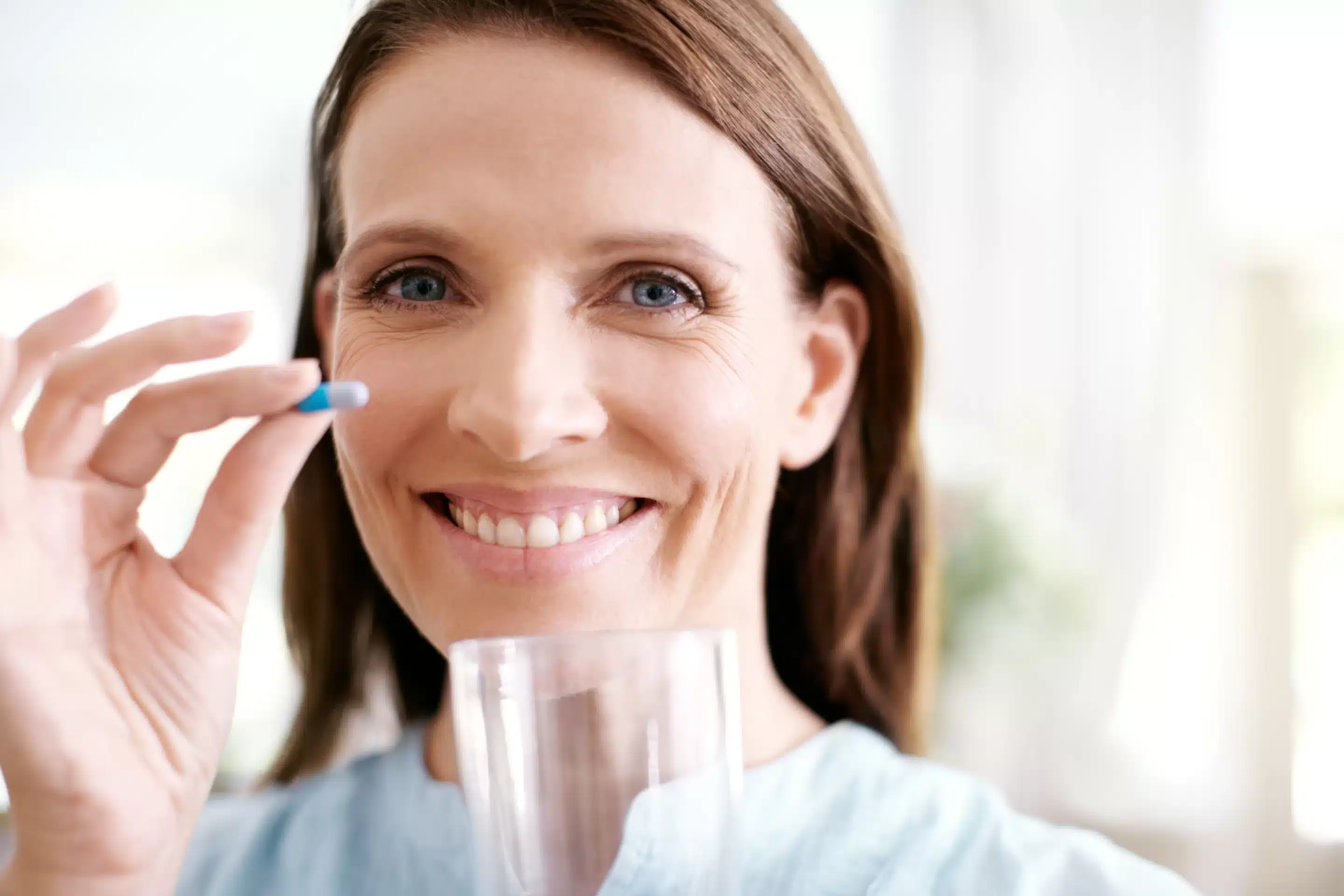 Ketamine Woman, portrait and vitamin capsule for health in home