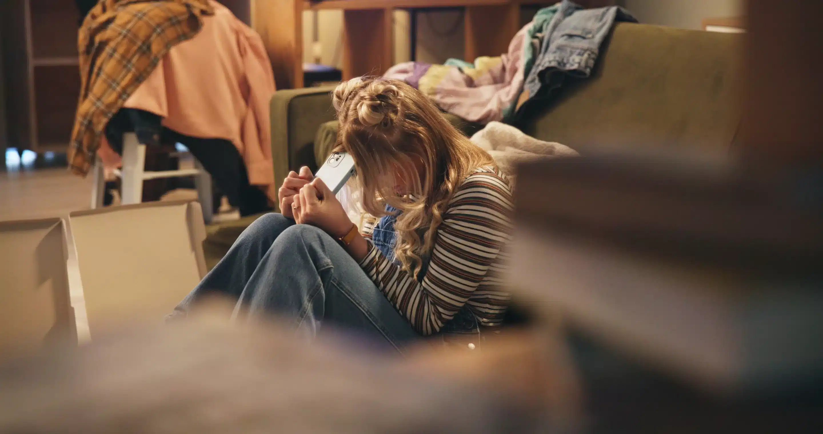 Woman, stress and moving on floor in apartment with boxes