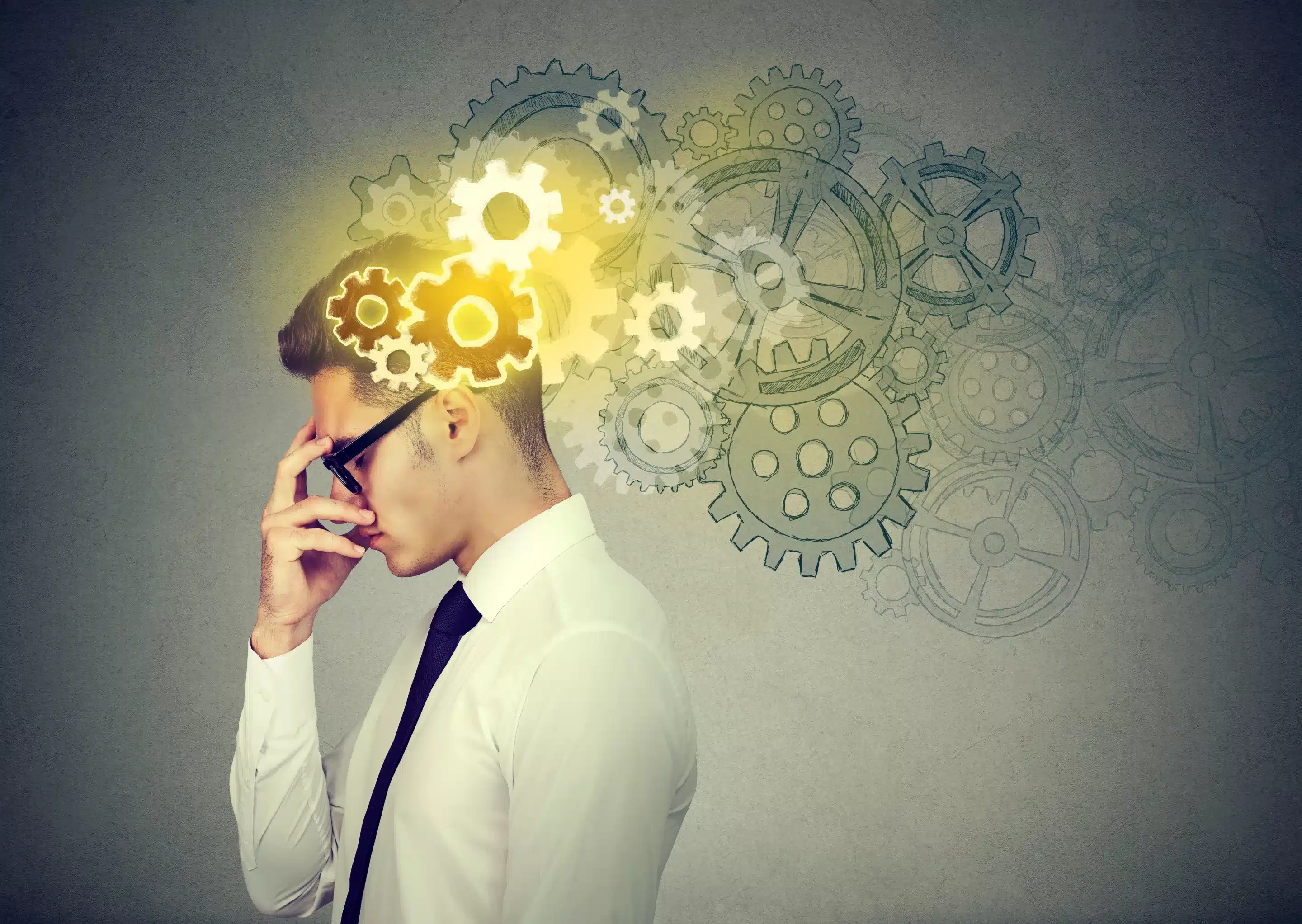 a man with his hand to his head