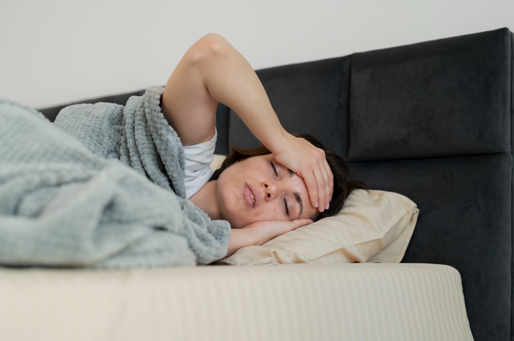 Sick woman resting in bed during illness - medium shot